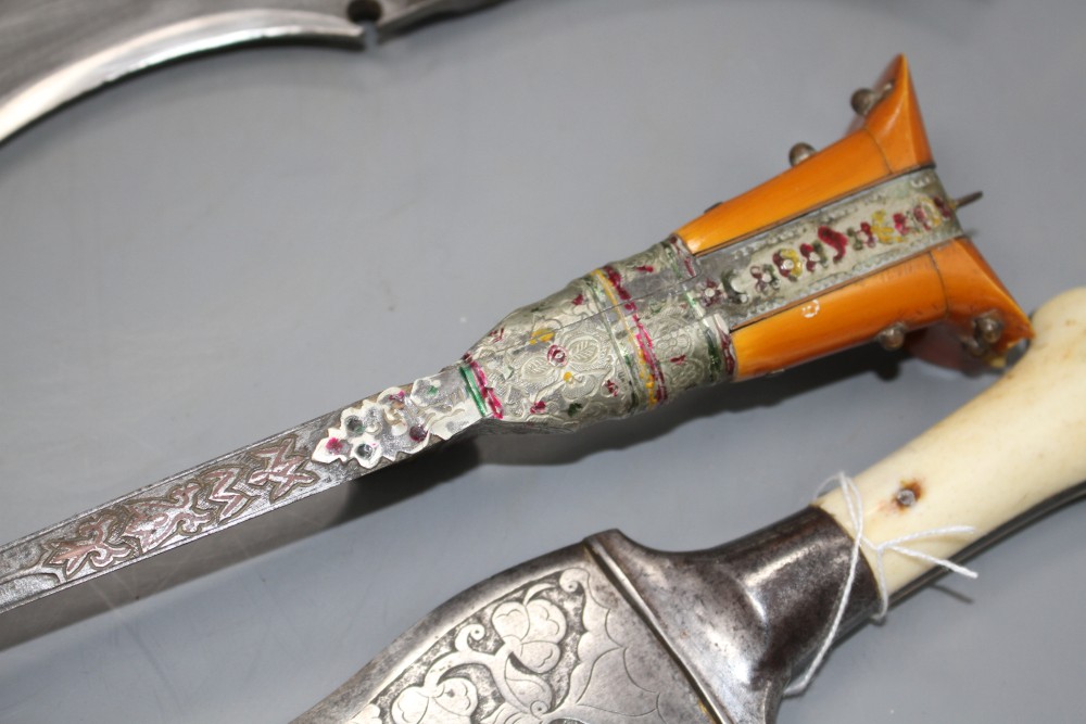 An Indian kukri c.1900, blade 31cms integral with hilt, layered ivory and horn grips, nickel pommel,